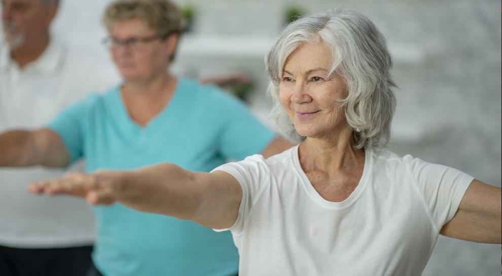 A woman enjoys yoga at a senior community in quitman ga