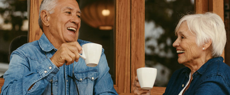 A man and woman enjoy coffee together