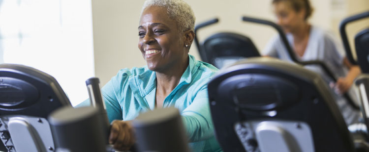 A senior woman works out